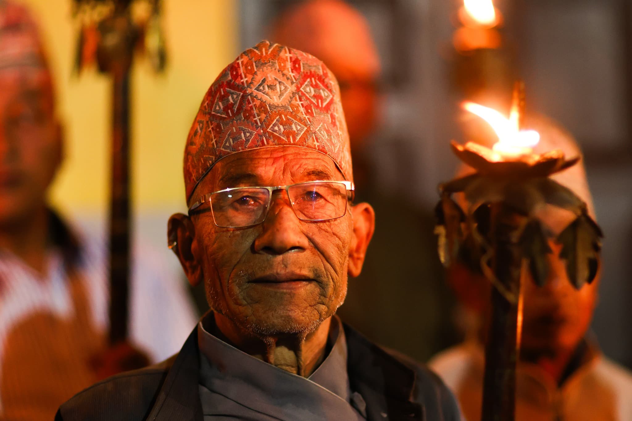 Portrait moment from a night festival gathering in Thimi.